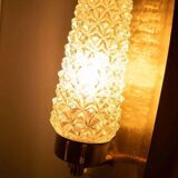 Vintage glass wall sconce from the 1960s in brass, mid-century light.