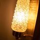 Vintage glass wall sconce from the 1960s in brass, mid-century light.