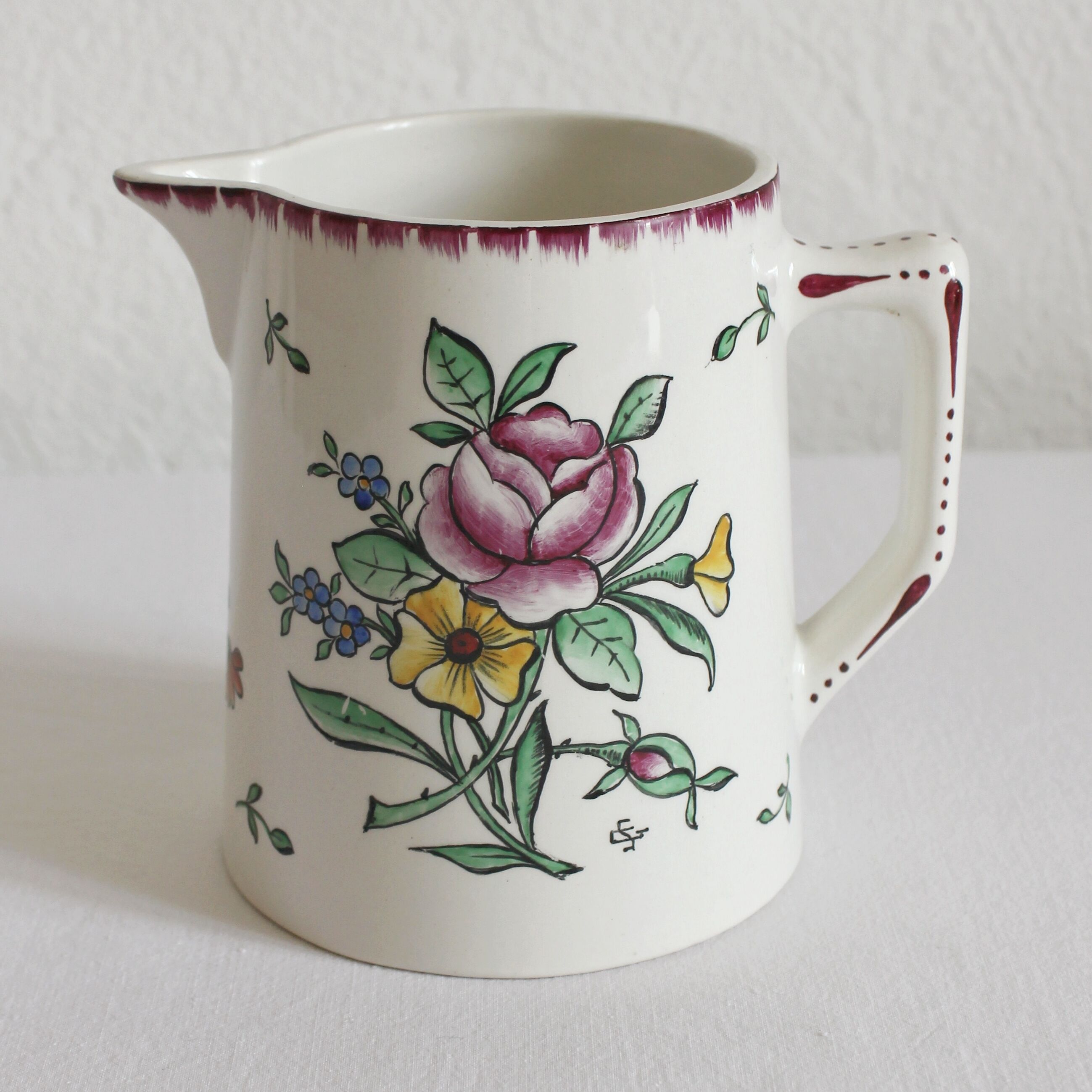 Earthenware jug with floral decoration from Digoin Sarreguemines.