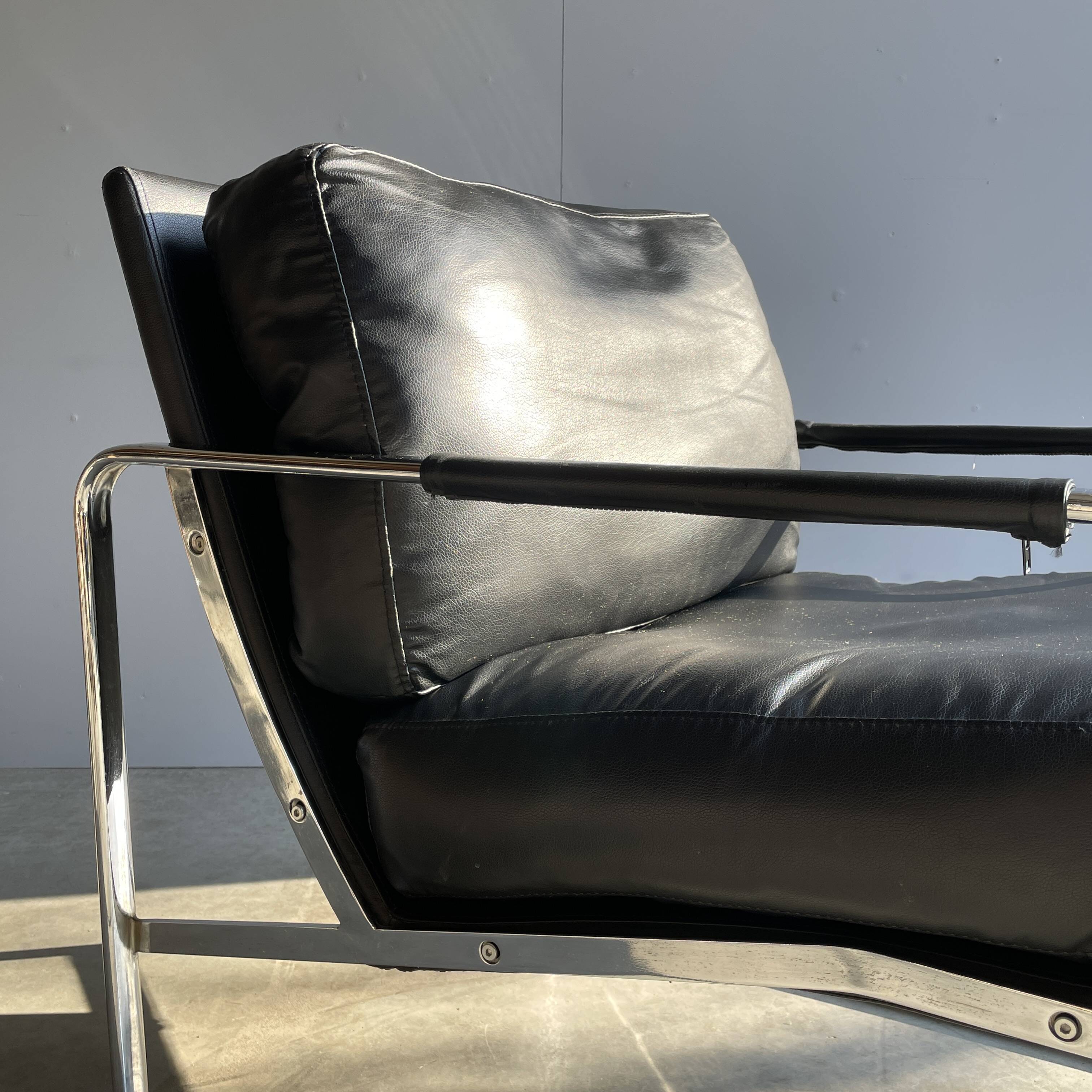 Vintage black leather armchair on metal base, 1980s