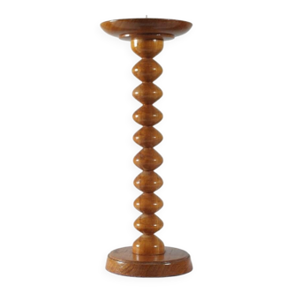 Vintage mid-century wooden candlestick, spool decoration from the 1970s.