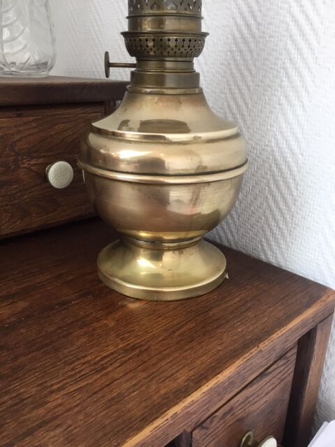 Old-fashioned brass standing oil lamp