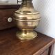 Old-fashioned brass standing oil lamp