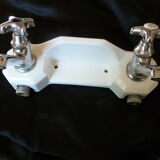 Old ceramic bathroom shelf with 2 chrome bronze faucets