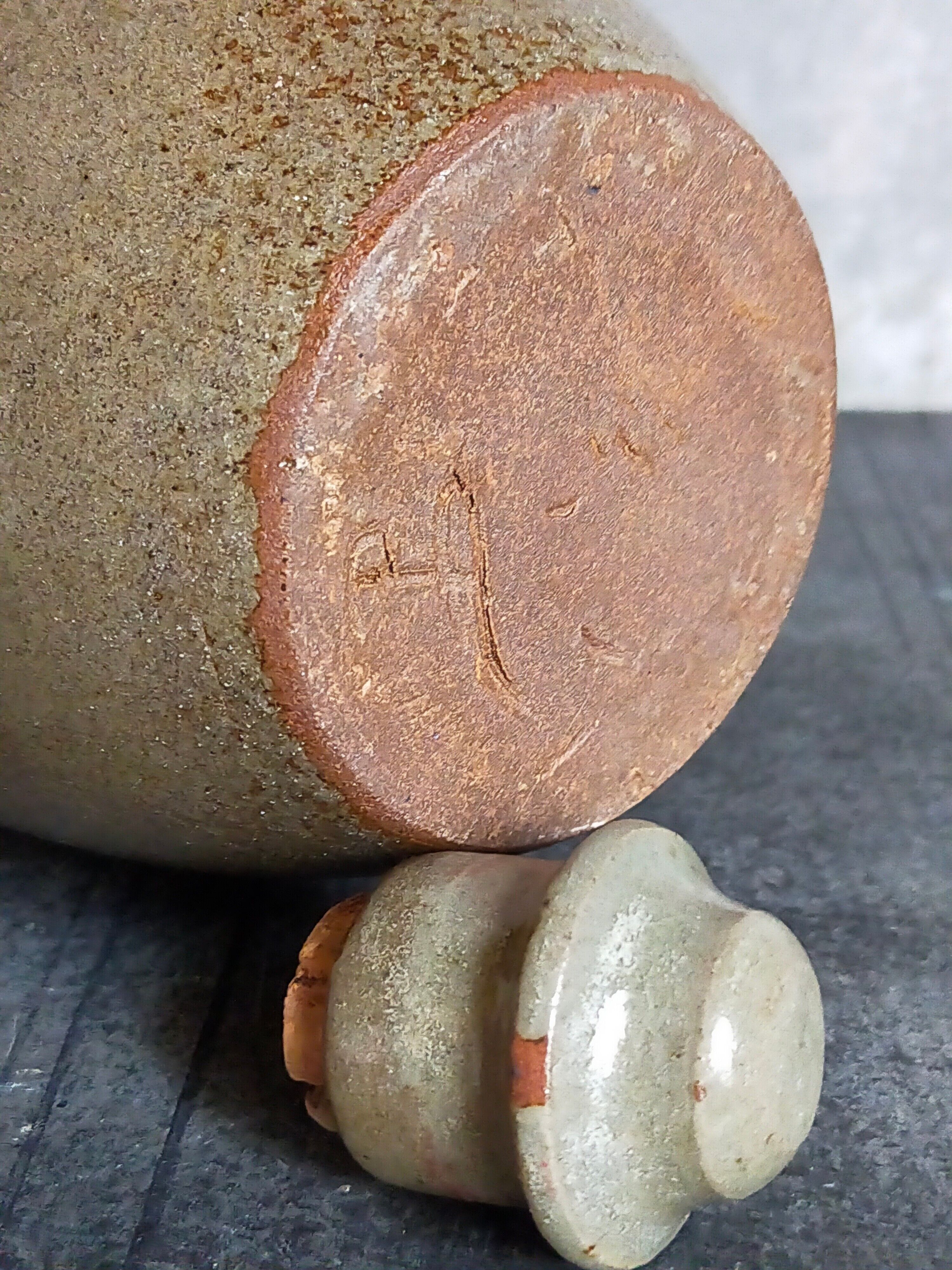 Vintage glazed stoneware potter's liquor bottle