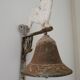 Cloche de porte en fonte