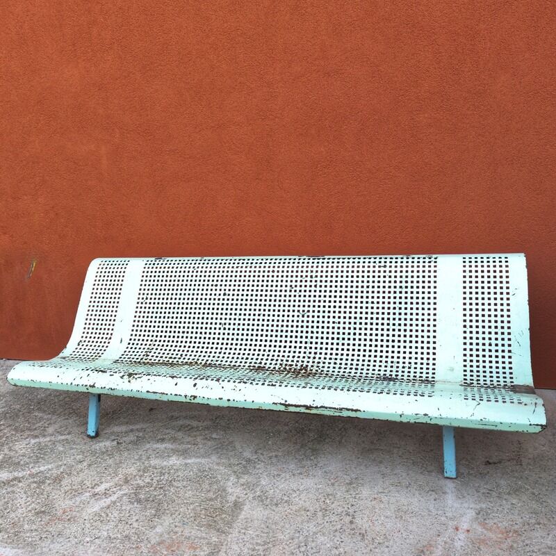 Public bench made of perforated iron