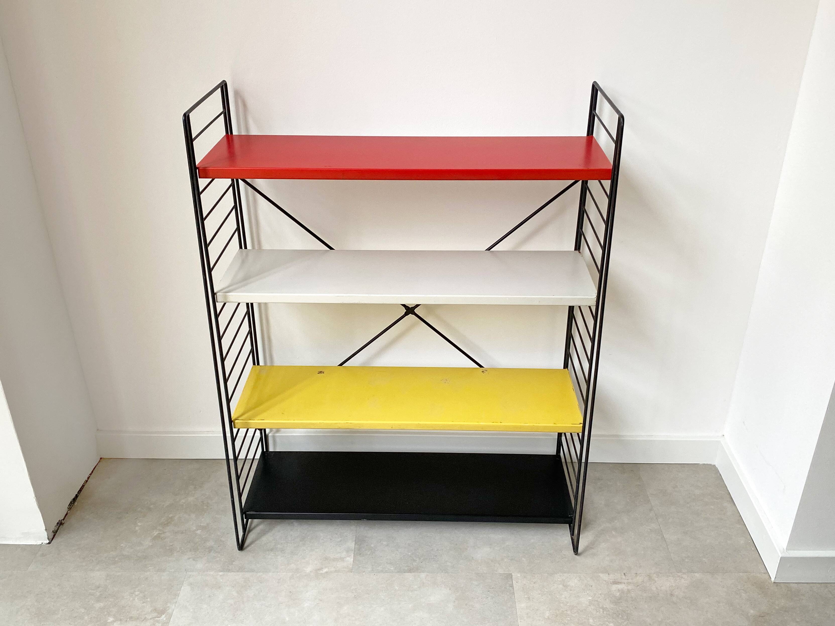 Mid century free standing tomado shelving system / bookcase designed by d. dekker