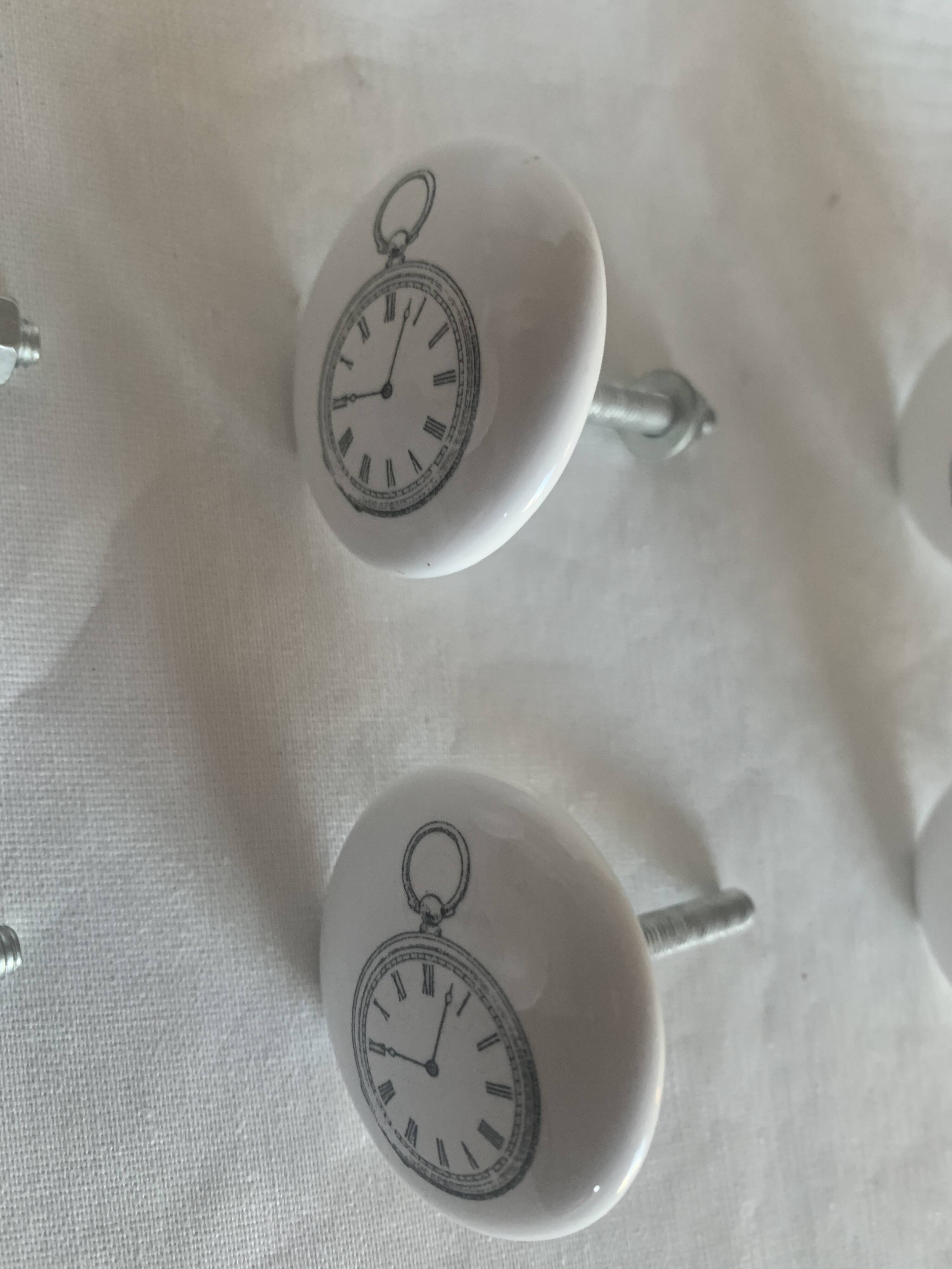 white ceramic door knobs with illustration