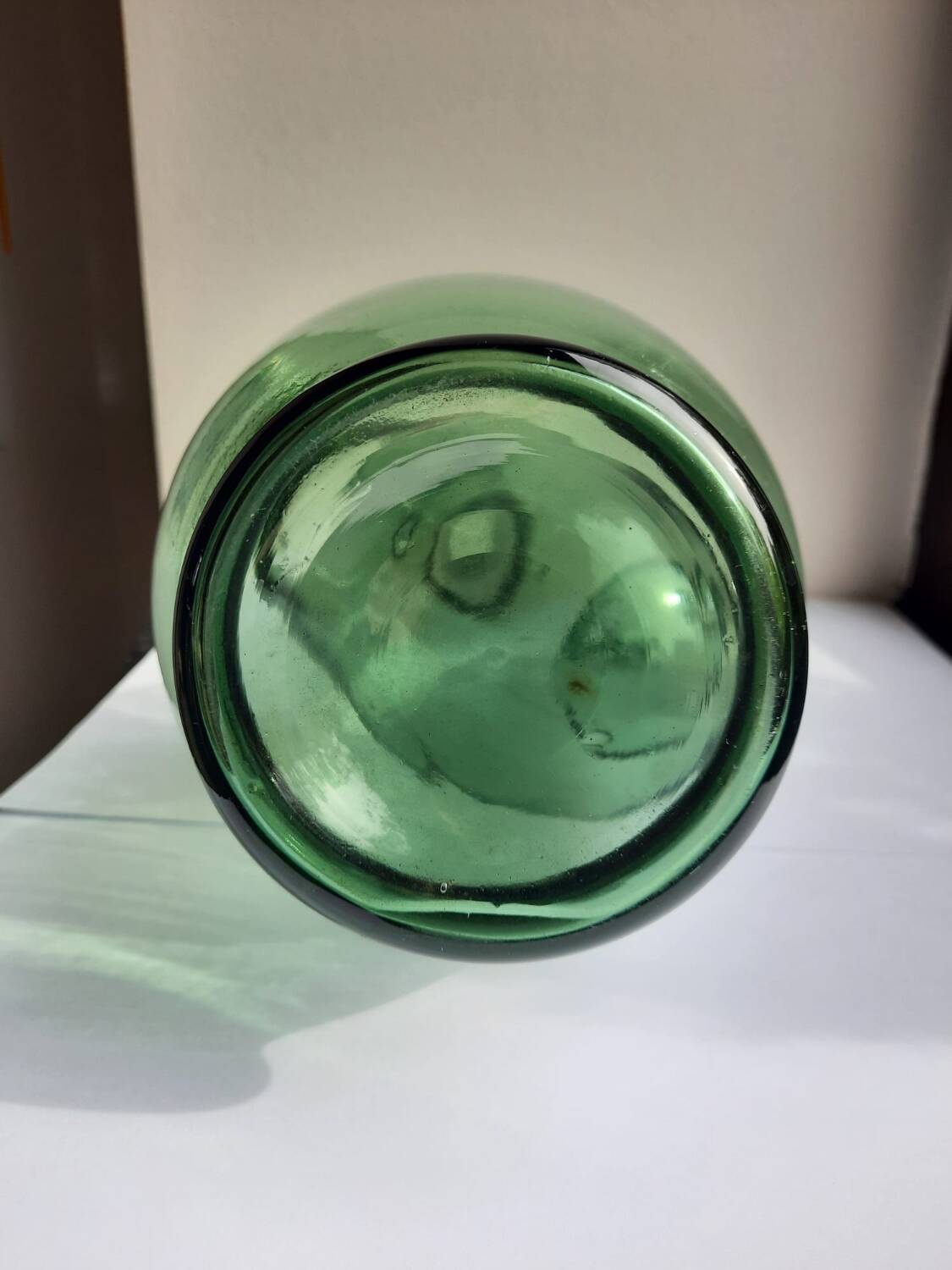 Pair of blown glass wine decanters in blue/green hues.