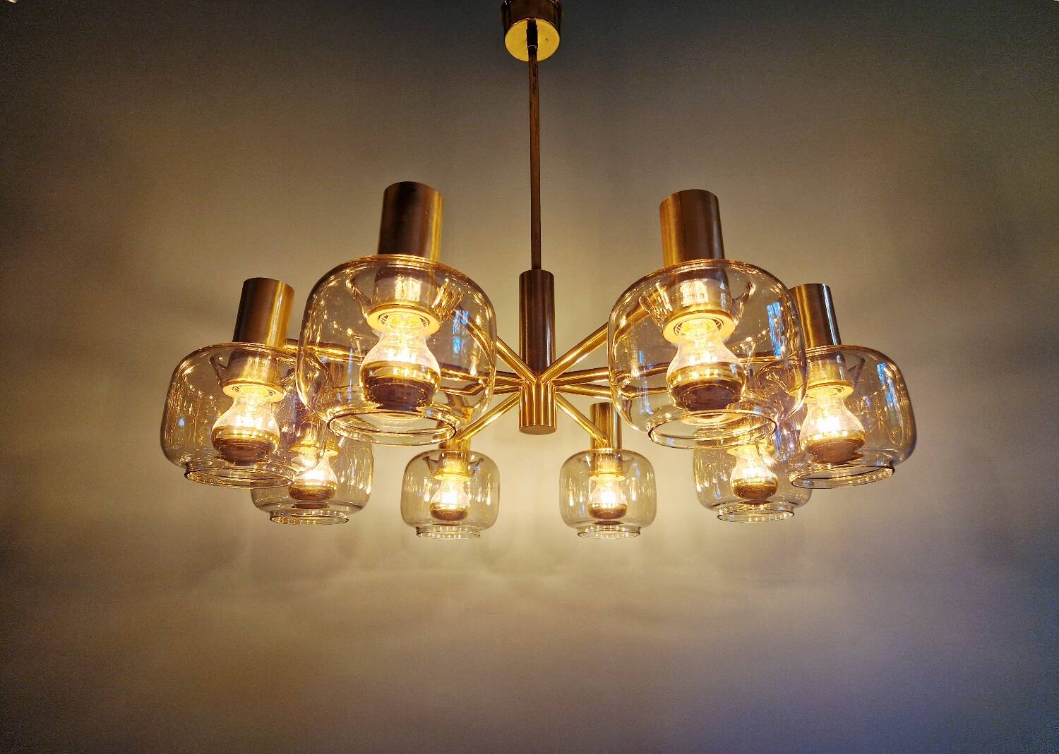 Large designer chandelier in brass and smoked glass globes, 1970s