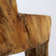 Brutalist sculptural chair in solid oak in wabi-sabi style.
