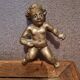 Rare bronze child statuette with blue eyes