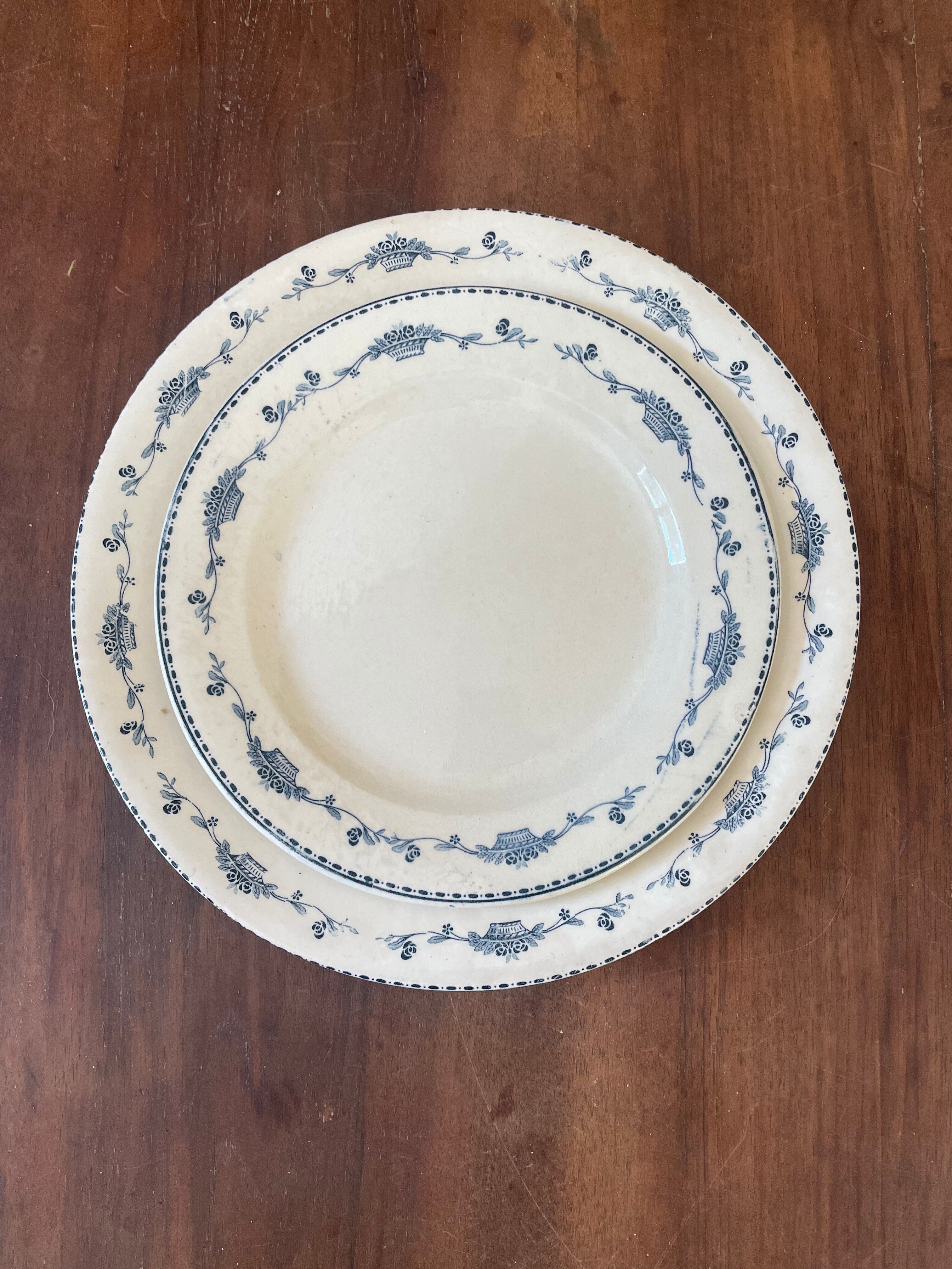 Two round dishes Terre de Fer Salins E.C Model "Roger"