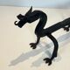 Paire de chenets aux dragons en fer forgé
