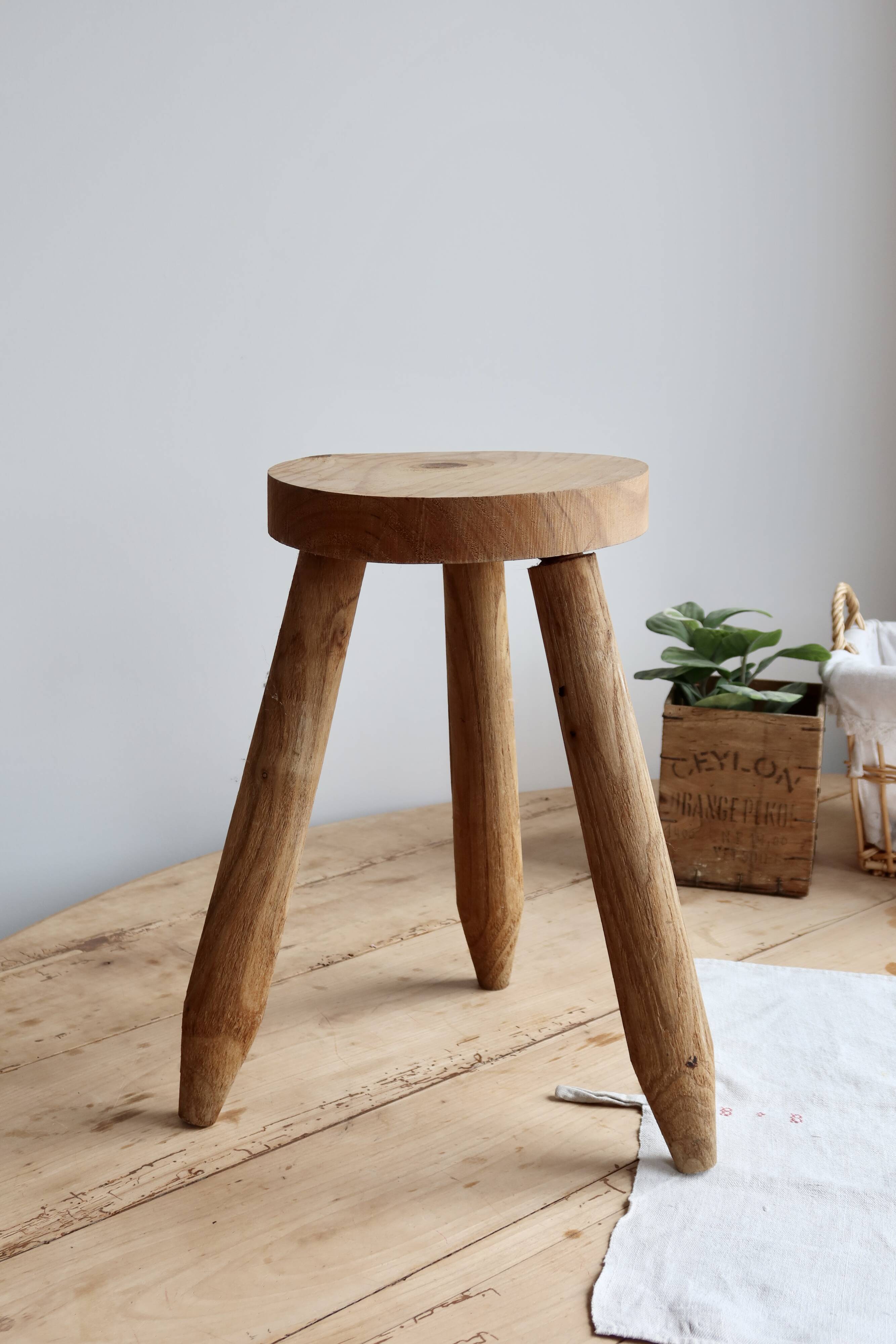 Vintage tripod stool in light raw wood