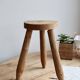 Vintage tripod stool in light raw wood