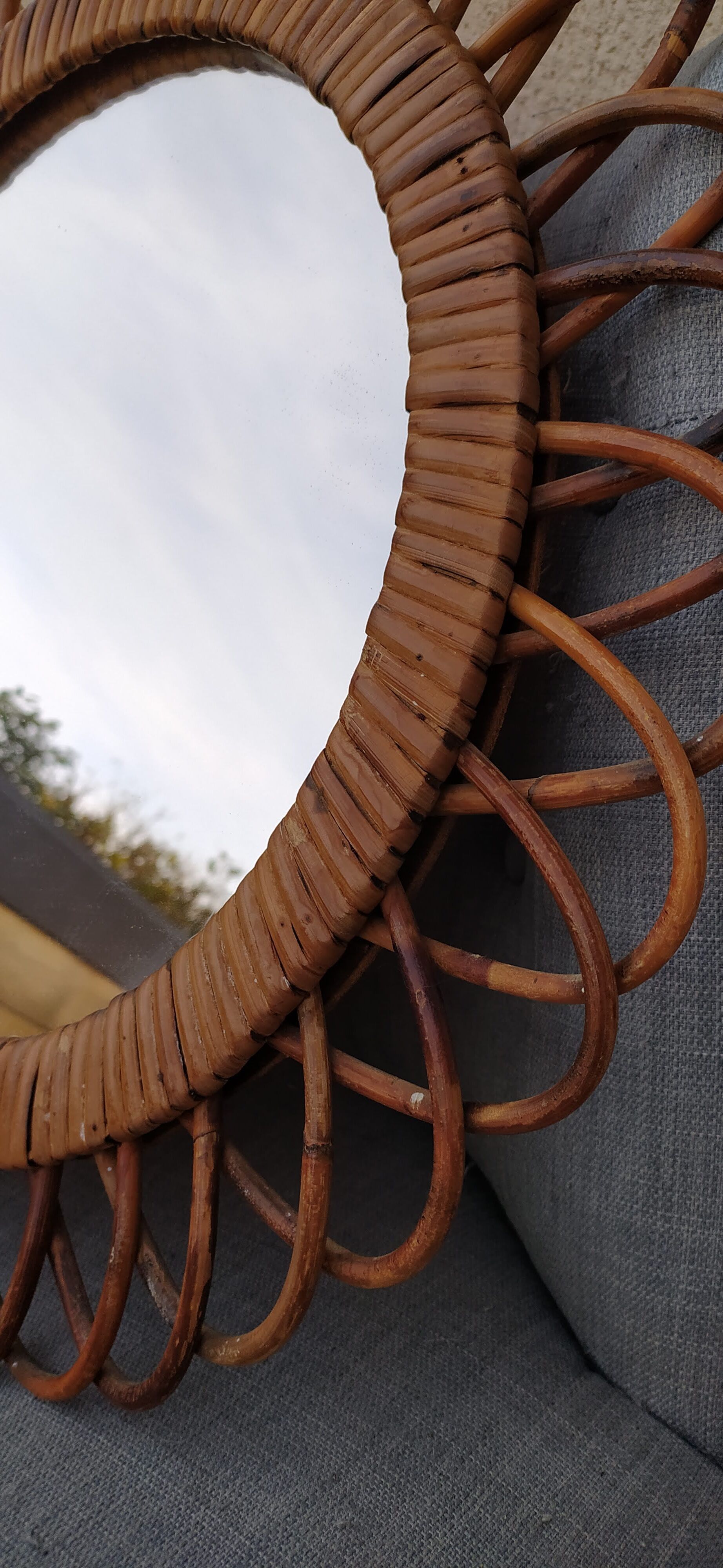 Vintage mirror in rattan flowers, sun