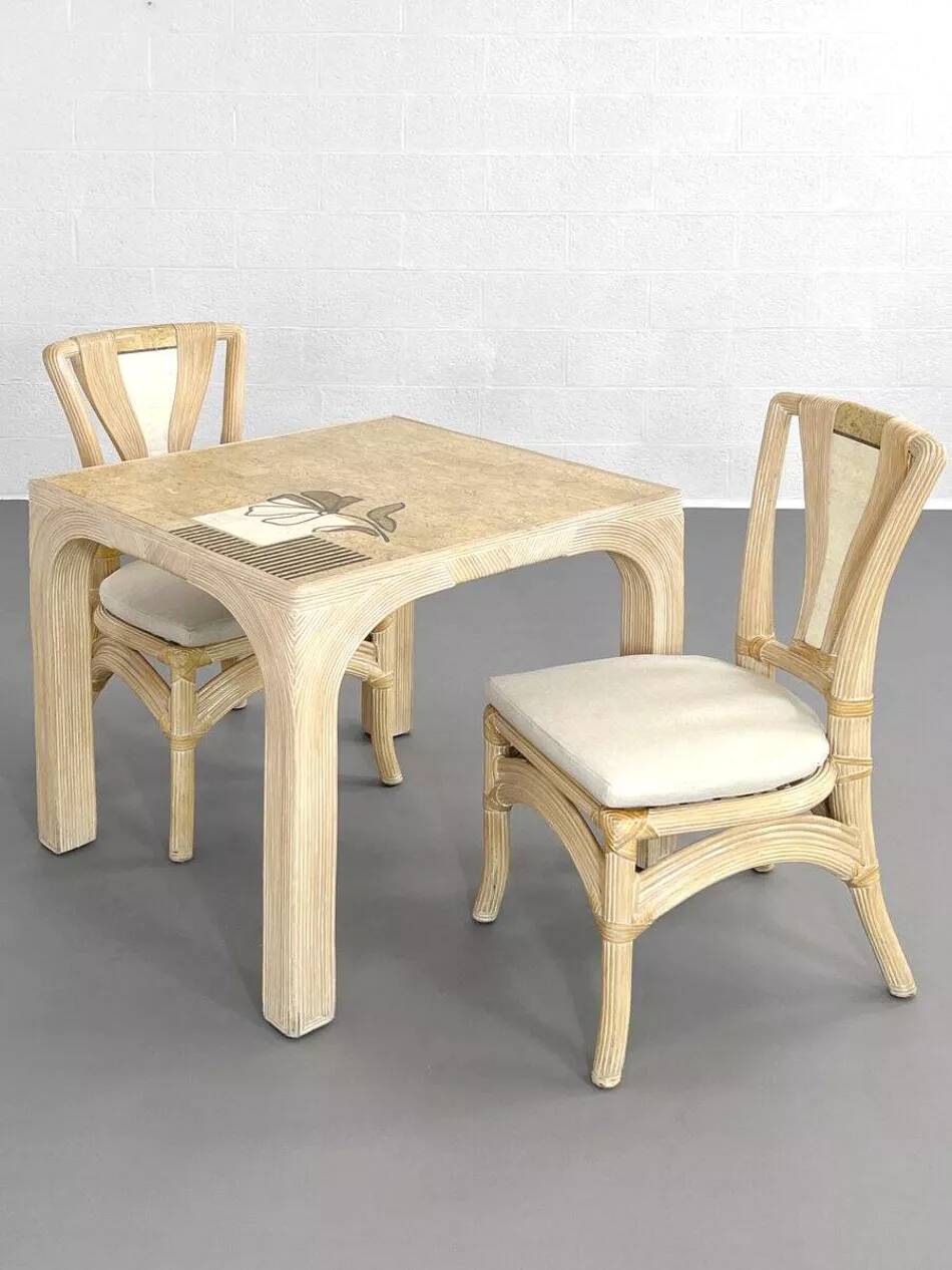 1970s rattan table with stone marquetry and matching chairs.