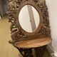 Carved mirror with integrated shelf