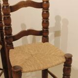 Pair of rustic chairs in turned wood with straw seats