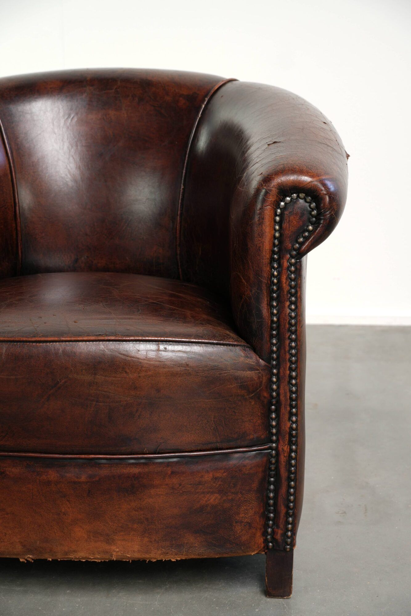 Vintage sheepskin club armchair with beautiful colours and a subtle size