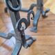 Pair of wrought iron andirons by Landier from the 17th century.
