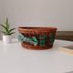 Vintage wicker and rattan basket with tartan fabric.