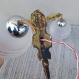 Pair of frosted glass wall lights with brass attachments, circa 1970