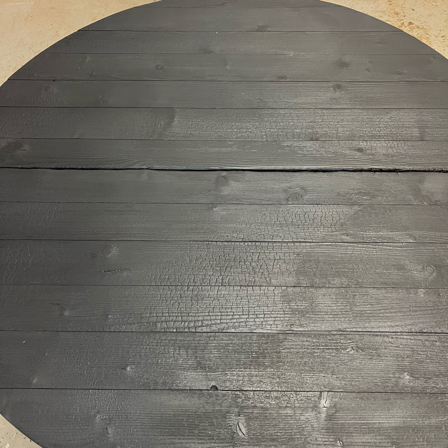 Brutalist round table in burnt wood yakisugi