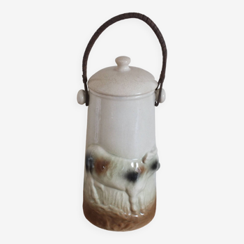 Antique milk jug in cow decoration slip