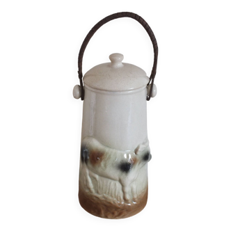 Antique milk jug in cow decoration slip