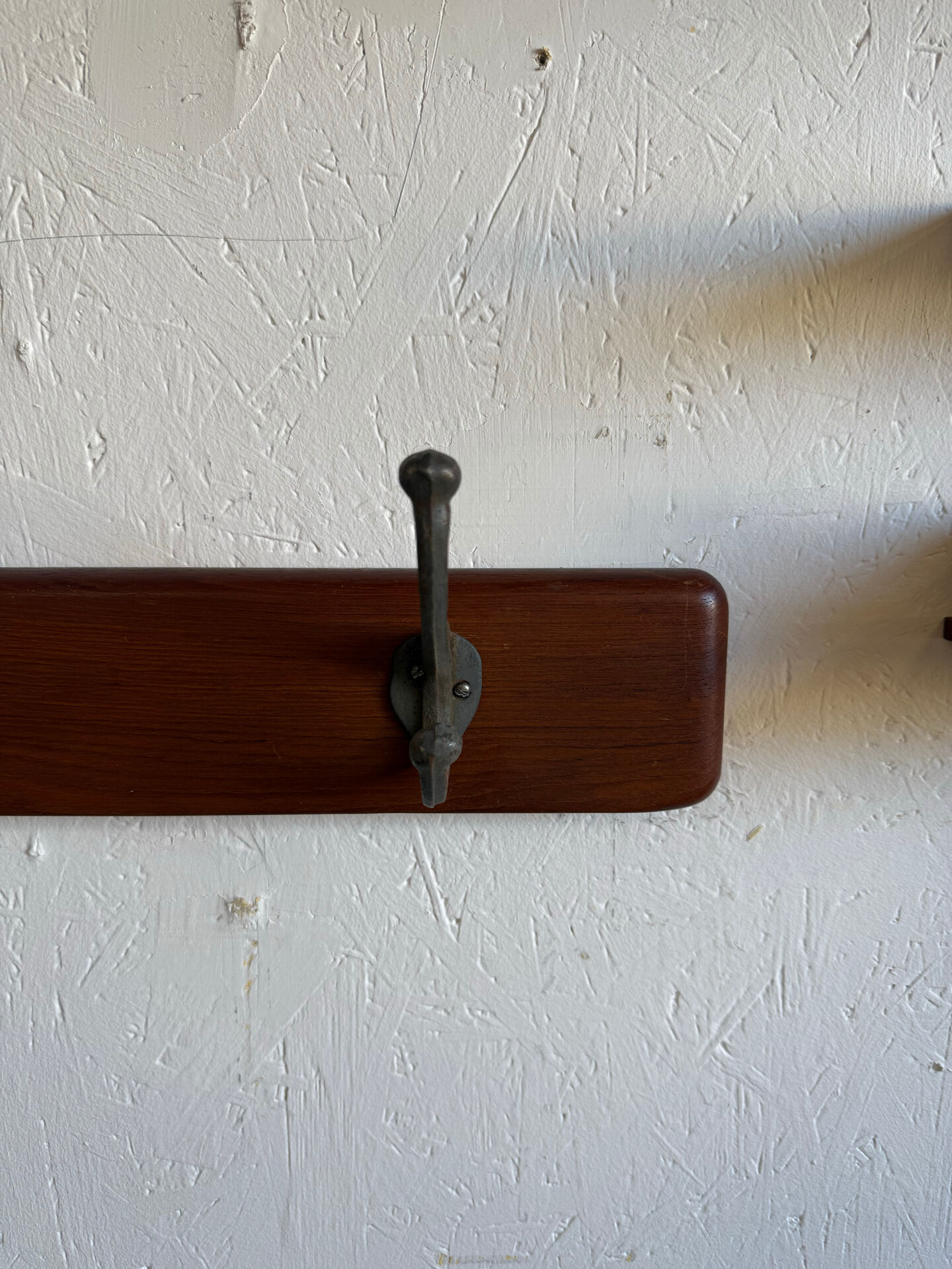 Scandinavian coat rack in solid teak from the 1970s.