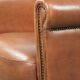 Armchair made of sheepskin leather with refined decorative nail finish