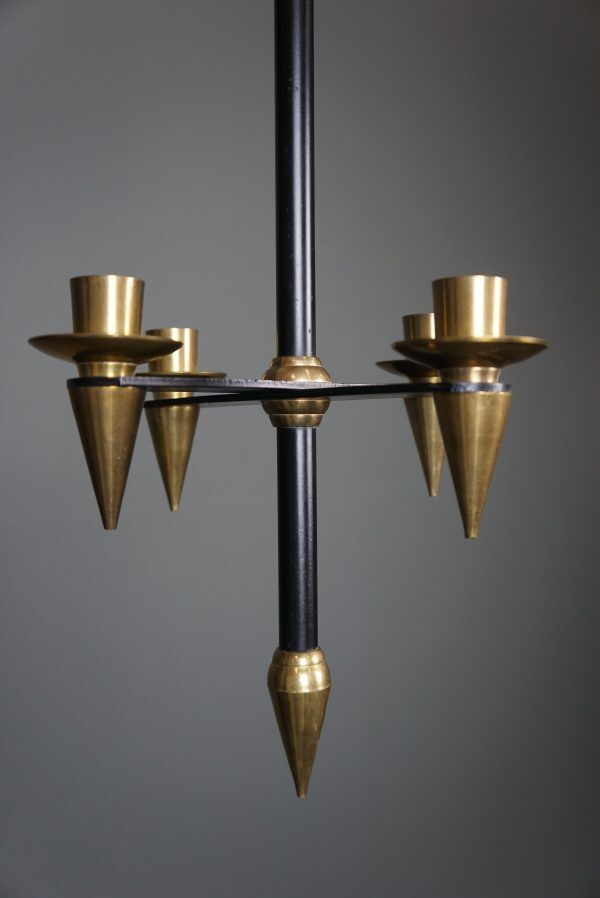 Candle holder in black metal and brass