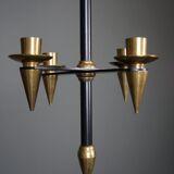 Candle holder in black metal and brass