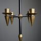 Candle holder in black metal and brass