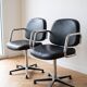 Pair of vintage swivel armchairs in metal and black faux leather.