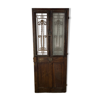 Old wooden front door with windows