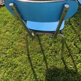 Two blue chairs in formica