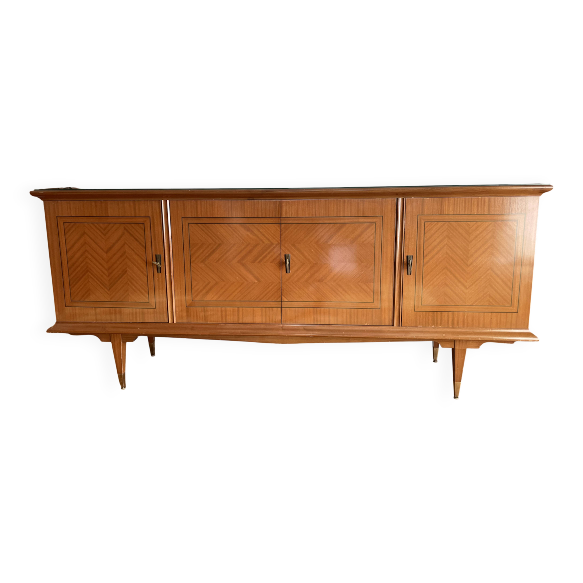 Vintage 4-door buffet with wood veneer and glass top.