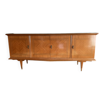 Vintage 4-door buffet with wood veneer and glass top.