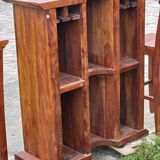 Exotic wood bar with 2 high stools.
