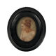 Miniature on medallion porcelain, blackened wooden frame
