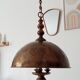 Rustic old wooden and brass suspension.