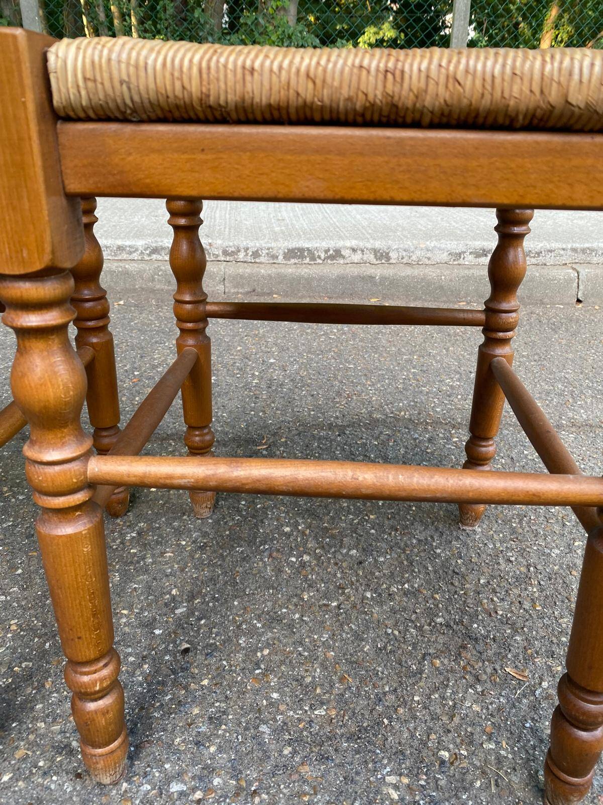 2 square stools made of carved solid wood with rush seats from the 1970s.