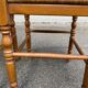 2 square stools made of carved solid wood with rush seats from the 1970s.