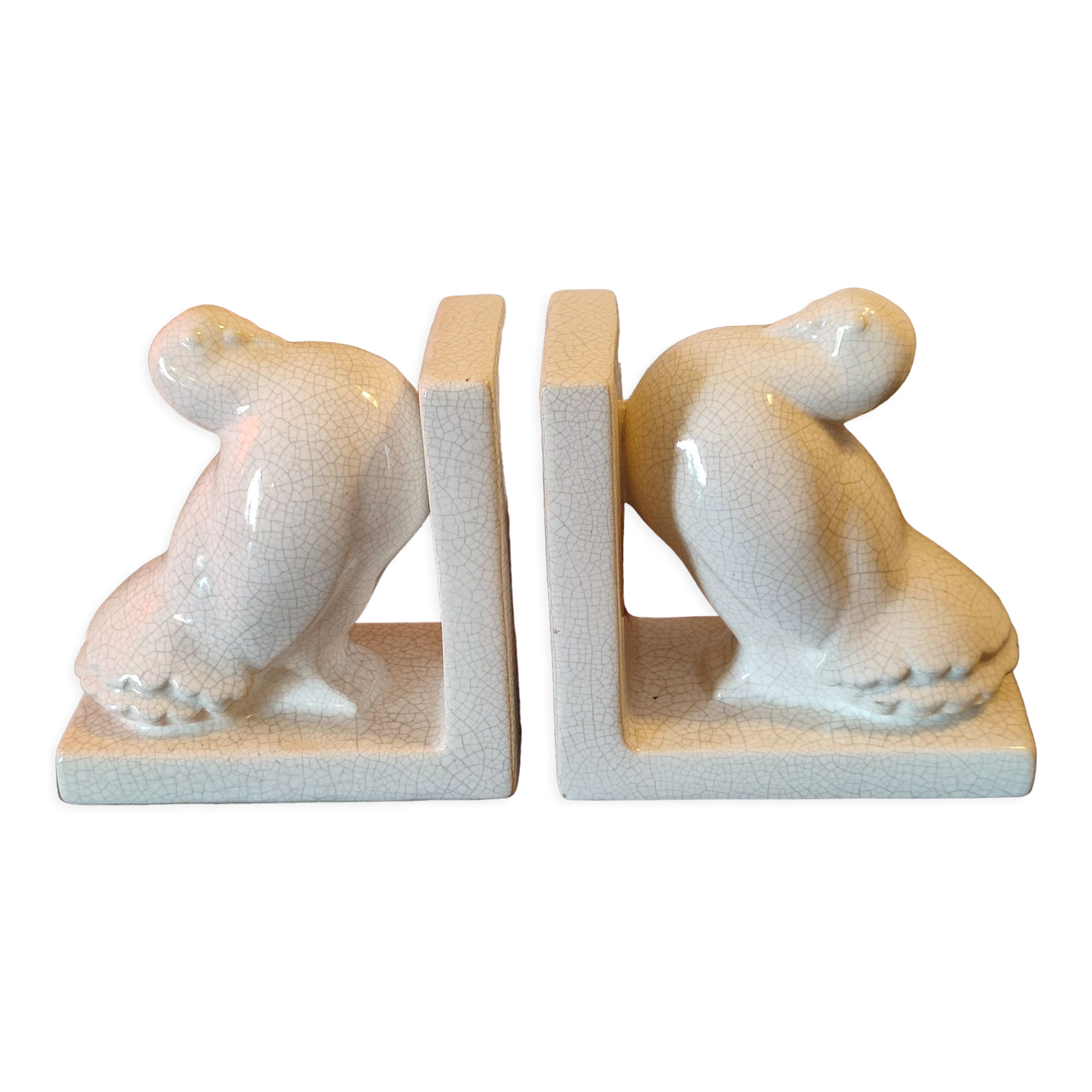 Pair of greenhouse art-deco books about cracked earthenware bird