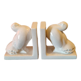 Pair of greenhouse art-deco books about cracked earthenware bird