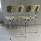 Pair of chairs in "wood" formica and gold edges, 1960s